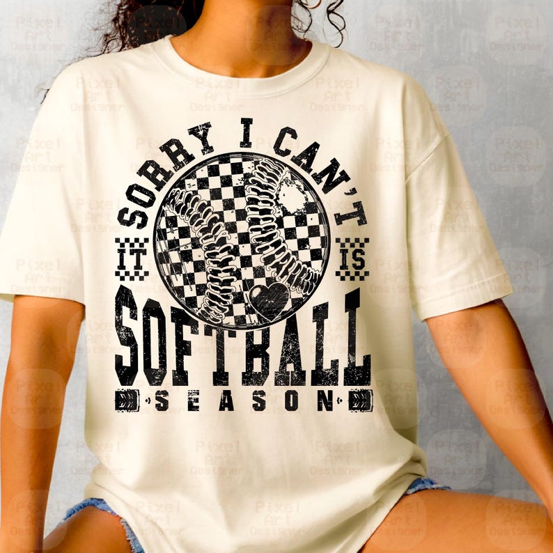 May include: A white t-shirt with a black graphic design featuring a softball with a checkered pattern and the text "Sorry I can't it is softball season".