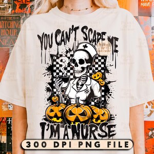 May include: Cream-colored t-shirt featuring a Halloween-themed graphic. The design includes a skeleton dressed as a nurse, holding a cup, with the text "YOU CAN'T SCARE ME I'M A NURSE". Orange pumpkins are also featured in the design.