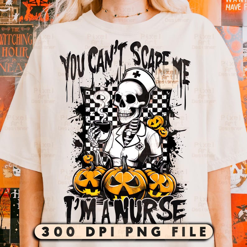 May include: Cream-colored t-shirt featuring a Halloween-themed graphic. The design includes a skeleton dressed as a nurse, holding a cup, with the text "YOU CAN'T SCARE ME I'M A NURSE". Orange pumpkins are also featured in the design.