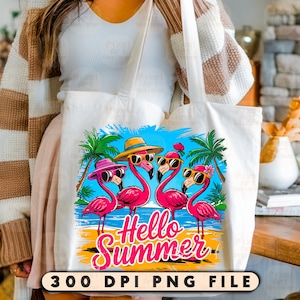 May include: A white tote bag with a colorful design featuring four pink flamingos wearing sunglasses and hats. The flamingos are standing on a beach with palm trees and the text "Hello Summer".