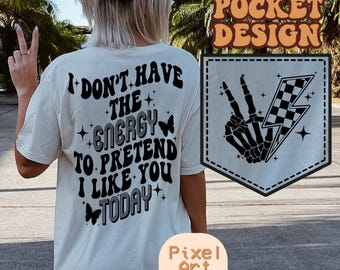 May include: White t-shirt with black text that reads "I don't have the energy to pretend I like you today". The shirt has a pocket on the back with a black and white checkered lightning bolt and a skeleton hand with peace sign fingers.
