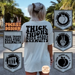 May include: A white t-shirt with the text "Thick Thighs Make Great Earmuffs" in black, retro-style lettering. The shirt has a pocket on the front with the same text in a smaller font. There are four additional images of the text in a circle with different graphic designs.