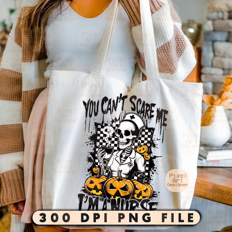May include: White tote bag with a Halloween-themed design. The graphic features a skeleton nurse with the text "You Can't Scare Me I'm a Nurse" and jack-o'-lanterns. The bottom of the bag has the text "300 DPI PNG FILE".