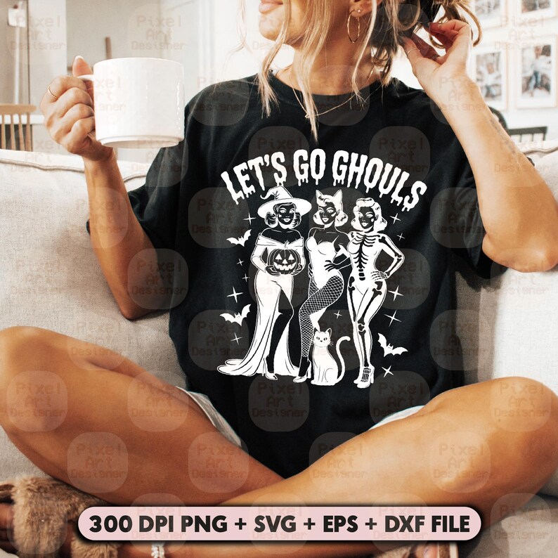 May include: Black t-shirt featuring the phrase "LET'S GO GHOULS" and a graphic of three women in Halloween costumes: a witch, a cat woman, and a skeleton. The image also includes the text "300 DPI PNG + SVG + EPS + DXF FILE".