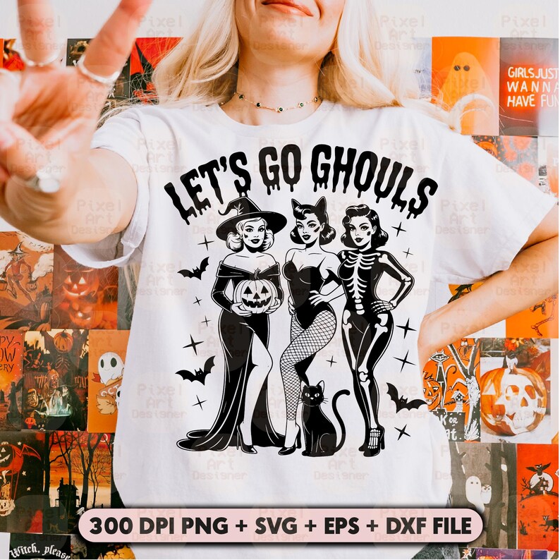 May include: White t-shirt with a Halloween graphic. The design shows three stylized women dressed as a witch, a cat, and a skeleton, with the text "LET'S GO GHOULS". Includes bats, crosses, and a black cat. The bottom of the shirt has the text "300 DPI PNG + SVG + EPS + DXF FILE".