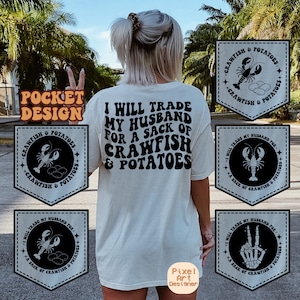 May include: A white t-shirt with the text "I will trade my husband for a sack of crawfish & potatoes" printed in black. The shirt has four pocket designs with crawfish and potato graphics. The text "Pocket Design" is in a yellow box at the top of the image.