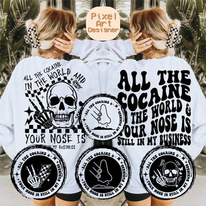 May include: White sweatshirt with a black graphic print that says "All the Cocaine in the World & Your Nose is Still in My Business". The graphic includes a skull, a nose, and a chequered flag.