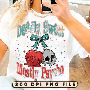 May include: White t-shirt with a graphic design featuring a red candy apple and a gray skull, tied together with a teal bow. The text reads "Deadly Sweet" and "Mostly Psycho" in teal and red. The bottom of the shirt has the text "300 DPI PNG FILE".