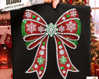 May include: Black square featuring a large, sparkling Christmas bow design. The bow is adorned with red, green, and white crystals, with snowflake accents. The text "FREE 10 DESIGNS INCLUDED" is in the upper left corner.