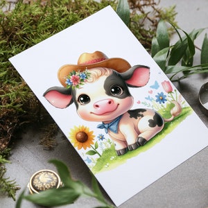 May include: A cute cartoon cow wearing a brown cowboy hat with a floral band, a blue bandana, and sitting in a field of flowers.