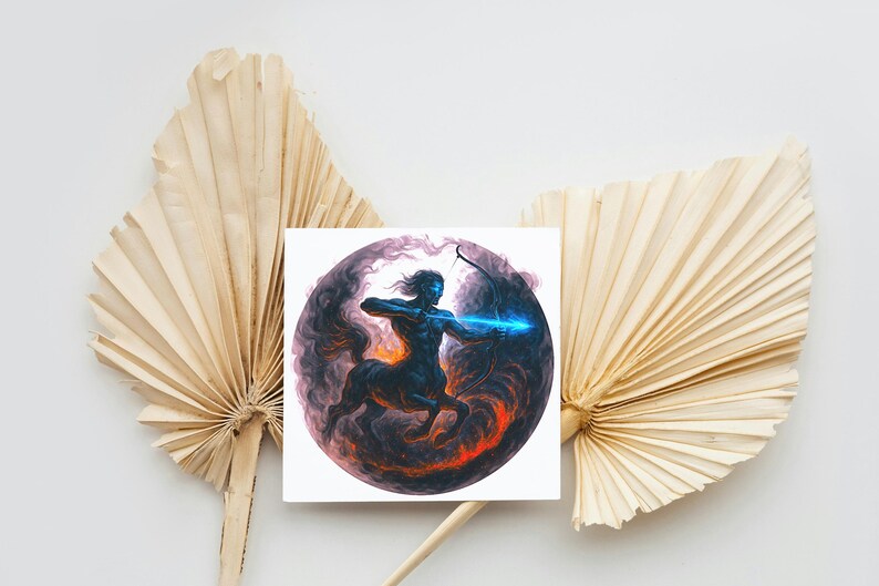 May include: A square print featuring a centaur archer with a glowing blue arrow, set against a dark, swirling background with orange and purple hues. The artwork is placed in front of dried palm leaves.