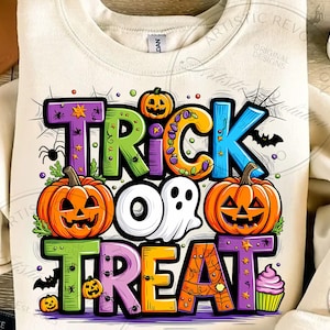May include: A cream-colored sweatshirt featuring a colorful graphic with the text TRICK OR TREAT. The design includes two orange jack-o'-lanterns, a white ghost, a purple cupcake, spiderwebs, small spiders, and bats in vibrant shades.