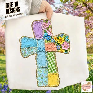 May include: A white fabric with a colorful cross design. The cross is made of various textured patches in pastel colors, including blue, green, pink, and yellow, with floral and patterned details. The text "FREE 10 DESIGNS INCLUDED" is in the upper left corner.