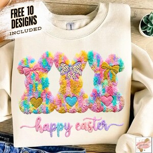 May include: Cream-colored sweatshirt featuring three colorful bunny designs with heart-shaped accents. The bunnies have bows and are made of fluffy, textured material. The words "happy easter" are embroidered below the bunnies. The text "FREE 10 DESIGNS INCLUDED" is at the top.