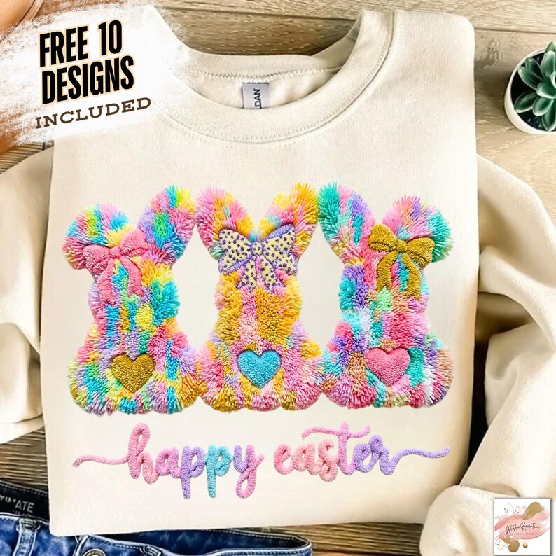 May include: Cream-colored sweatshirt featuring three colorful bunny designs with heart-shaped accents. The bunnies have bows and are made of fluffy, textured material. The words "happy easter" are embroidered below the bunnies. The text "FREE 10 DESIGNS INCLUDED" is at the top.