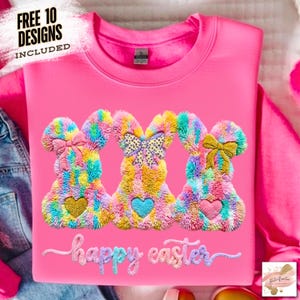 May include: A bright pink sweatshirt featuring three colorful bunny designs with heart accents and bows. The words "happy easter" are embroidered below the bunnies. The top left corner reads "FREE 10 DESIGNS INCLUDED".