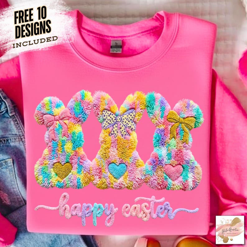 May include: A bright pink sweatshirt featuring three colorful bunny designs with heart accents and bows. The words "happy easter" are embroidered below the bunnies. The top left corner reads "FREE 10 DESIGNS INCLUDED".