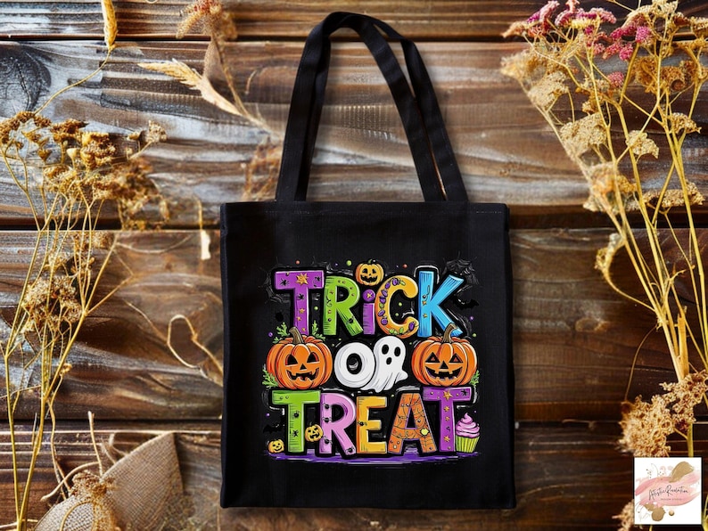 May include: A black tote bag featuring a colorful graphic with the text TRICK OR TREAT. The design includes two orange jack-o'-lanterns, a white ghost, a small cupcake, and various small bats and stars in shades of purple, blue, and yellow.