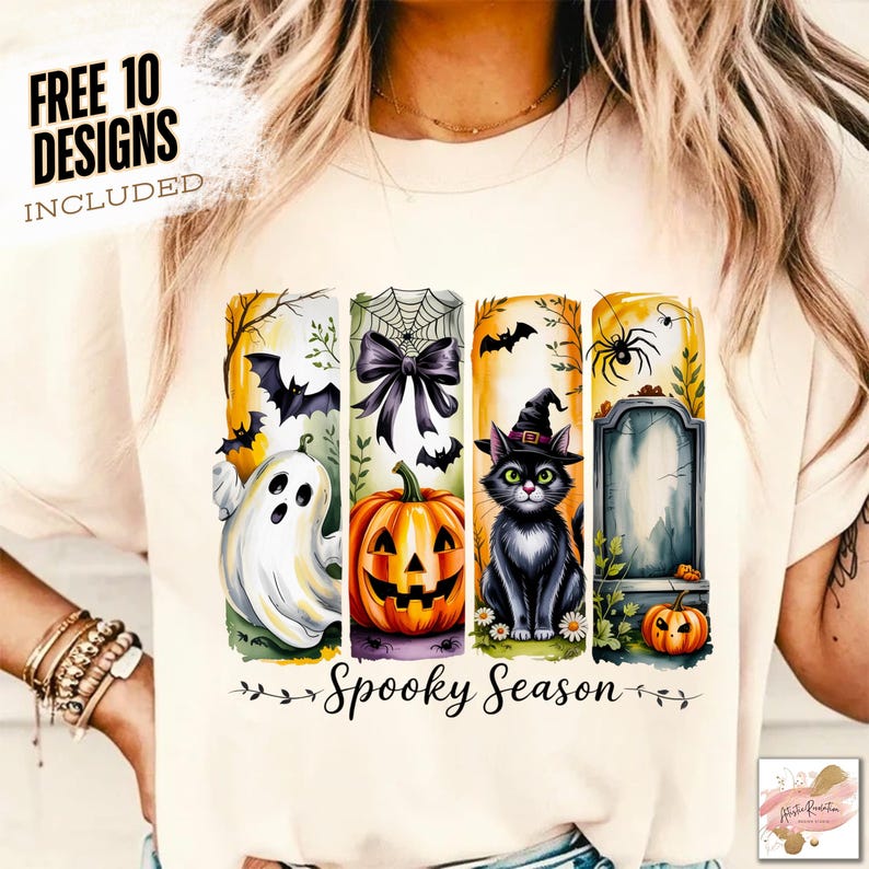 May include: Cream-colored t-shirt featuring a Halloween-themed design. The design includes a ghost, pumpkin, black cat, and tombstone, with the words "Spooky Season" and "Free 10 Designs Included".