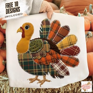 May include: A white fabric item featuring a colorful turkey design. The turkey is made of various plaid fabrics in shades of green, orange, yellow, and brown. The text "FREE 10 DESIGNS INCLUDED" is visible in the upper left corner. The item is held by a person.