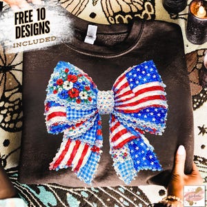 May include: A dark brown sweatshirt featuring a large bow design with an American flag theme. The bow incorporates red and white stripes, blue stars, and floral accents. The text "FREE 10 DESIGNS INCLUDED" is visible in the upper left corner.