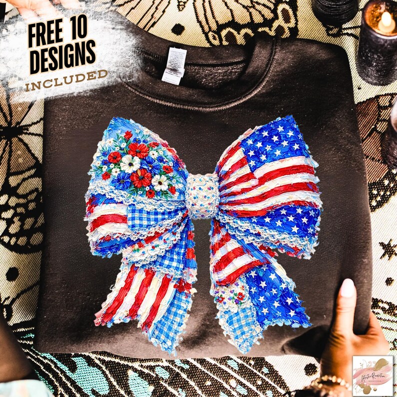 May include: A dark brown sweatshirt featuring a large bow design with an American flag theme. The bow incorporates red and white stripes, blue stars, and floral accents. The text "FREE 10 DESIGNS INCLUDED" is visible in the upper left corner.