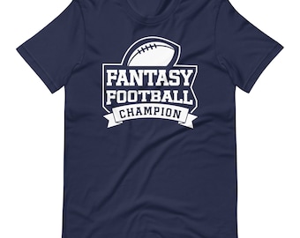 May include: Navy blue t-shirt with a white graphic of a football and the text "Fantasy Football Champion".