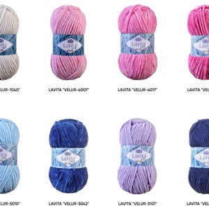 May include: Eight skeins of Lavita Velur yarn in various colors, including white, pink, blue, and purple. Each skein is wrapped with a blue and white label. The yarn is labeled with the name and color code.
