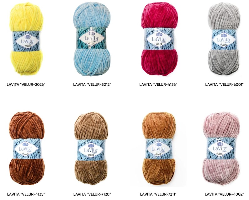 May include: A collection of eight skeins of Lavita Velur yarn in various colors, including yellow, blue, red, gray, brown, and pink. Each skein is labeled with the Lavita brand and a unique product code. The yarn has a soft, velvety texture.