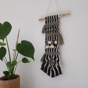 Macrame, driftwood and bead wall decoration