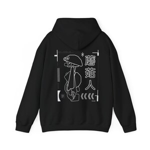 May include: Black hooded sweatshirt with a white graphic design of a cartoon character with a mushroom head. The text "蘑菇人" is also included in the design.