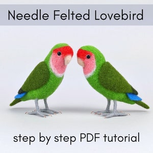 May include: Two needle felted lovebirds, one green with a pink chest and red head, the other green with a pink chest and red head, facing each other on a white background.  "Needle Felted Lovebird" and "step by step PDF tutorial" are written in black text below the birds.
