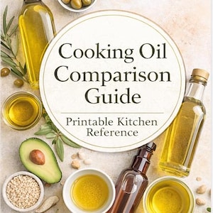 May include: A top-down shot of a cooking oil comparison guide. The image features bottles of oil, olives, avocado, and small bowls of ingredients. The text reads "Cooking Oil Comparison Guide" and "Printable Kitchen Reference."