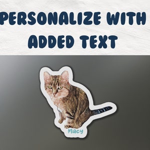 May include: A personalised cat sticker featuring a brown tabby cat sitting with its tail curled around its body. The sticker has a white border and the name "Macy" written in blue text on a light blue background.