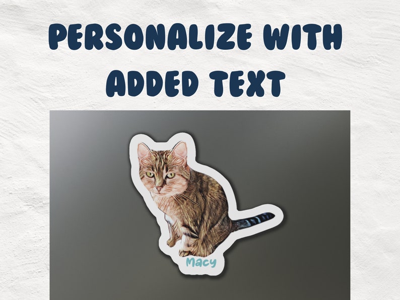 May include: A personalised cat sticker featuring a brown tabby cat sitting with its tail curled around its body. The sticker has a white border and the name "Macy" written in blue text on a light blue background.