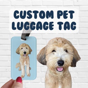 May include: A blue luggage tag with a custom photo of a dog. The tag has a black strap and the text "CUSTOM PET LUGGAGE TAG" is printed above the photo.