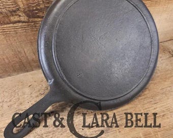 Piece of American history.  Late 1800's antique Gate marked Round Cast Iron Stove Eye Griddle.  Elegant and hard working. H Makers Mark