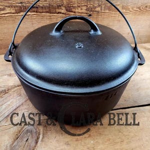 The Dutch Oven that started it all!  Elegant and Unknown &quot;Clara Bell&quot; Raised 8 Dutch Oven.  This one hits home!