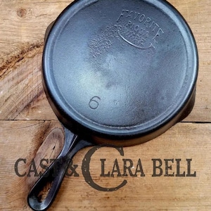 Not seen often.  Favorite Piqua Ware #6 Cast Iron Skillet with Heat Ring and Smiley Logo