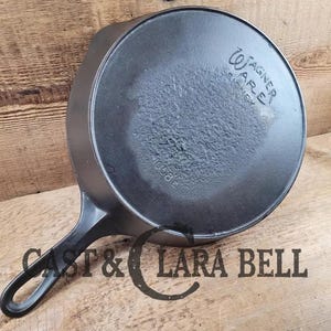 Great Price!  Daily User, 1920&#39;s era Wagner #8 Skillet with Heat Ring.  Some pitting on surface but otherwise beautiful restored piece!!