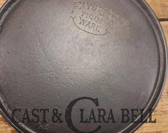 Tougher to find.  1920's Favorite Piqua Ware #7 Round Cast Iron Griddle with Smiley Logo.  Perfect grilled cheese and pancakes for one.