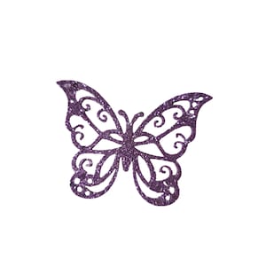 May include: A glittery purple butterfly cutout with intricate swirling patterns. The butterfly has a symmetrical design with detailed wings and a delicate body. The cutout is set against a plain white background.