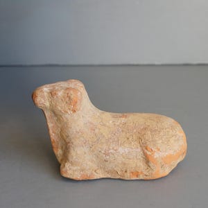 May include: A set of three ceramic mugs with a speckled, cream-colored glaze. Each mug features a different hand-painted floral design in shades of blue, green, and yellow. The mugs have a simple, modern shape with a comfortable handle.