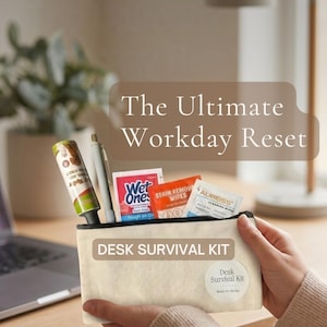 May include: A beige canvas zipper pouch labeled DESK SURVIVAL KIT containing a lint roller, a silver pen, and three small packets of cleaning wipes. The pouch features a circular sticker that also reads Desk Survival Kit in white text.
