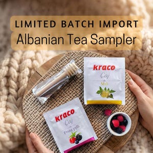 May include: A sampler set featuring two white tea packets labeled Kraco Çaj, one with Mali and one with Fruta pylli text. A wooden honey dipper in a clear plastic sleeve and a small white bowl containing red and black berries are included.
