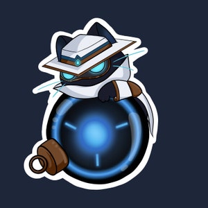 May include: A black cat wearing a white hat and a white scarf is holding a black orb with a glowing blue center. The orb has a brown metal ring attached to it.