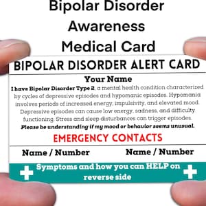 May include: A white card with blue and teal accents. The card reads "Bipolar Disorder Alert Card" and includes information about Bipolar Disorder Type 2. The card also has a section for emergency contacts.