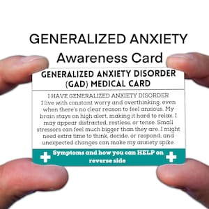 May include: A white card with the text "GENERALIZED ANXIETY Awareness Card" and "GENERALIZED ANXIETY DISORDER (GAD) MEDICAL CARD". The card includes a description of generalized anxiety disorder and symptoms. The card is held between two hands.
