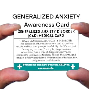 May include: A white and teal awareness card for Generalized Anxiety Disorder (GAD) held between two hands. The card reads "GENERALIZED ANXIETY DISORDER (GAD) MEDICAL CARD" and includes a description of the condition and its symptoms.