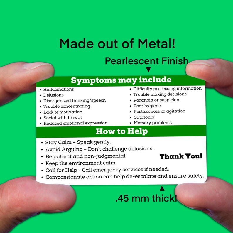 May include: A green card with the text "Made out of Metal! Pearlescent Finish" at the top. The card lists symptoms and how to help someone experiencing mental health challenges. The card is being held by a hand. The text "Thank You!" is at the bottom right corner of the card. The text ".45 mm thick!" is at the bottom center of the card.